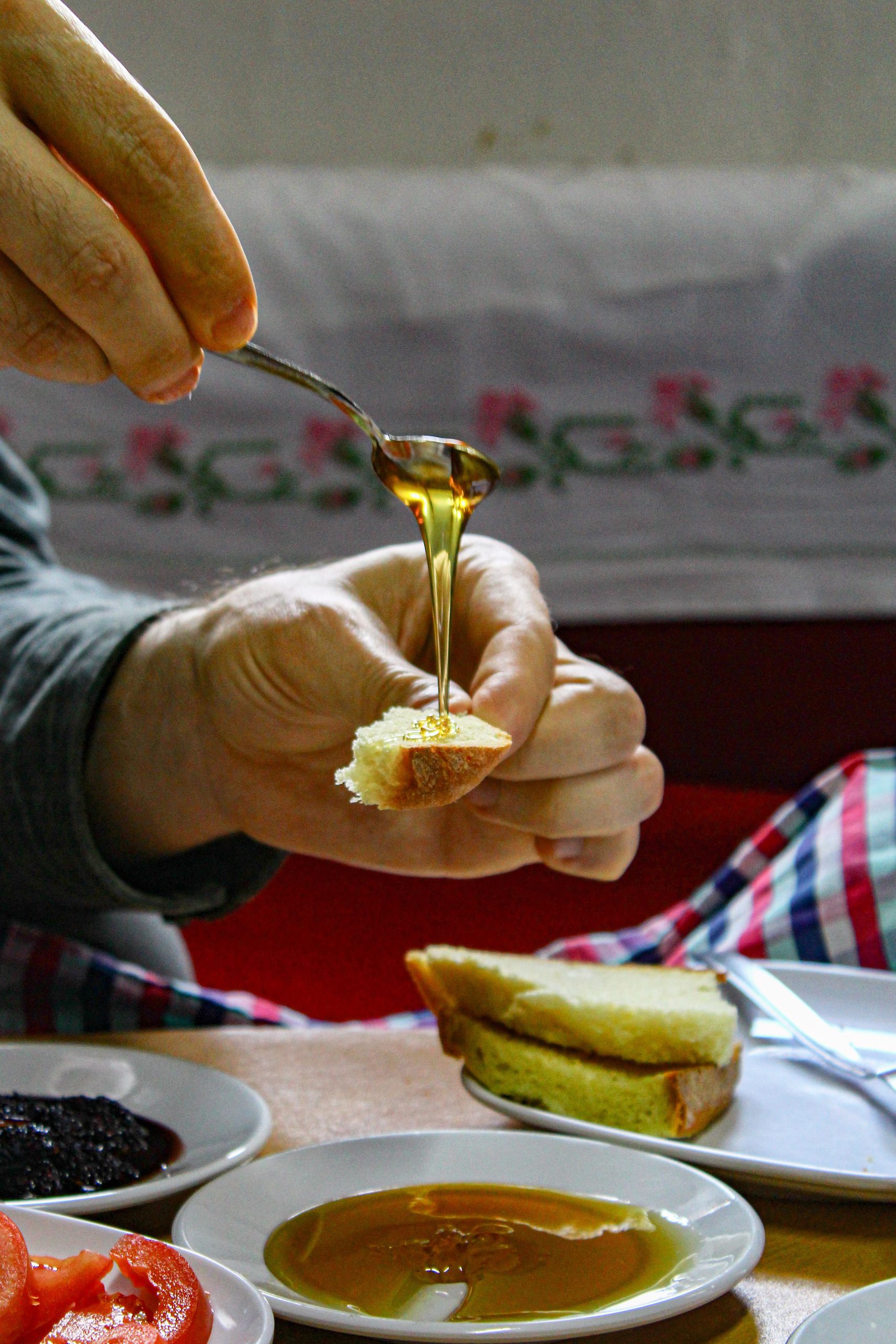 honey dripping to the piece of bread 
