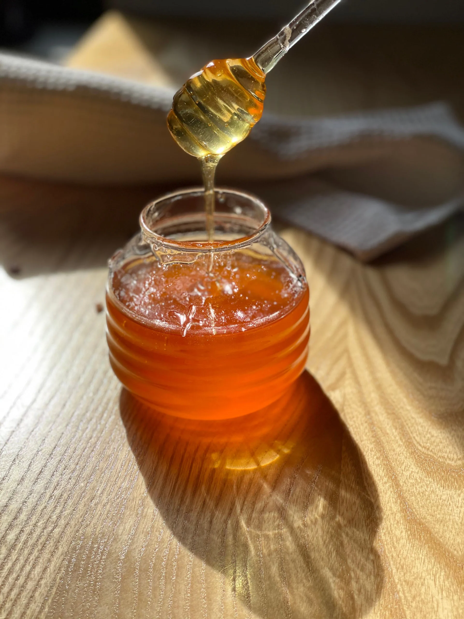 Honey dripping from the dripper spoon.